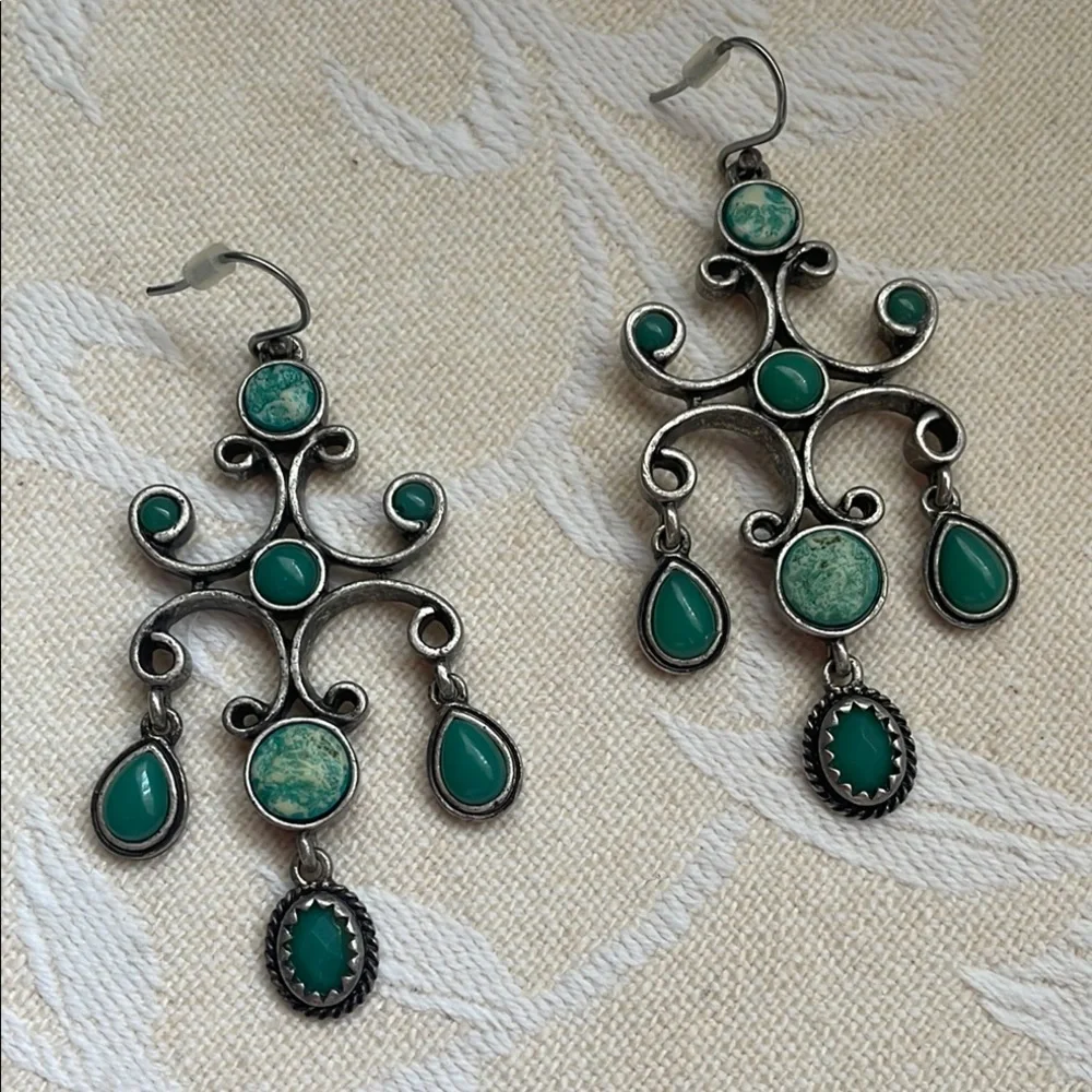Silver and Green Dangle Earrings with Intricate Design